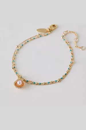 Anthropologie Bracelet à breloques coquillage plaqué or par en , pour femme