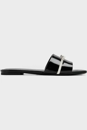 CHARLES & KEITH Claquettes bicolore ornées d