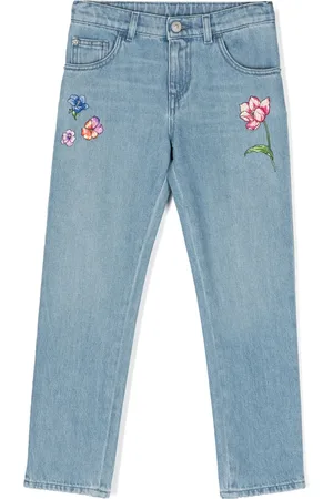 VERSACE Jean skinny à fleurs brodées