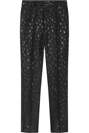 VERSACE Pantalon à imprimé léopard