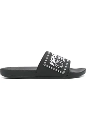 VERSACE Claquettes à logo embossé