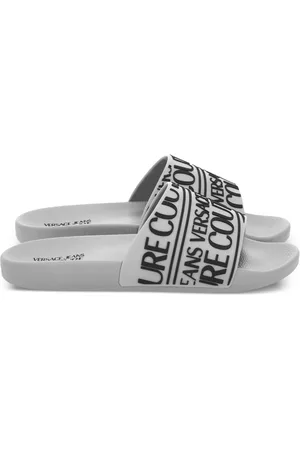 VERSACE Claquettes à logo en caoutchouc