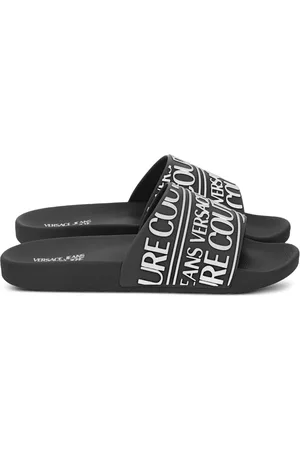 VERSACE Claquettes à logo en caoutchouc