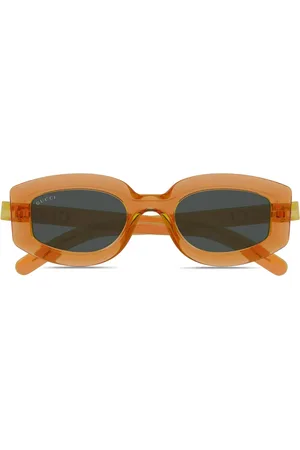 Gucci Lunettes de soleil à logo imprimé