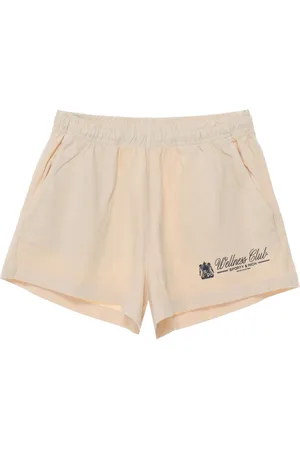 Sporty & Rich Short en coton à imprimé graphique