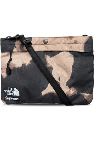 Supreme X TNF sac porté épaule en jean à effet délavé