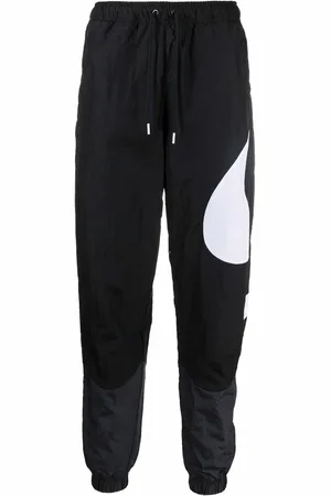 Nike Pantalon de jogging à imprimé Swoosh