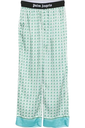 Palm Angels Pantalon à motif monogrammé imprimé