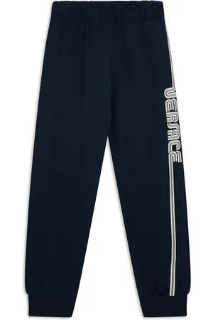 VERSACE Pantalon à logo imprimé