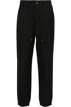 VERSACE Pantalon fuselé à détail V-Emblem