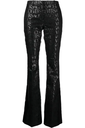 VERSACE Pantalon évasé Allover