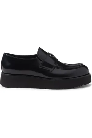 Prada Mocassins en cuir à plaque logo polie