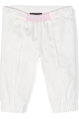 VERSACE Pantalon fuselé à bande Greca