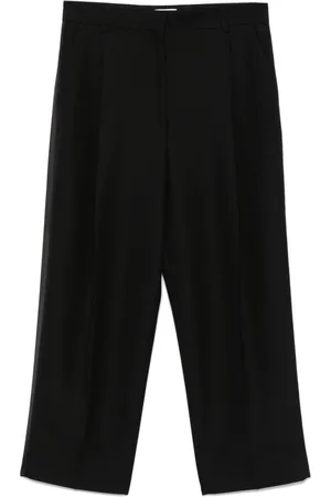 Totême Pantalon à design plissé
