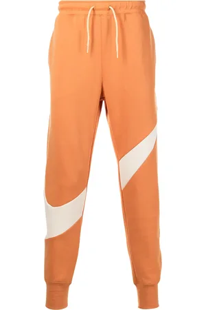 Nike Pantalon de jogging en polaire à imprimé Swoosh