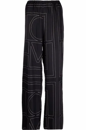 Totême Pantalon en soie à motif monogrammé