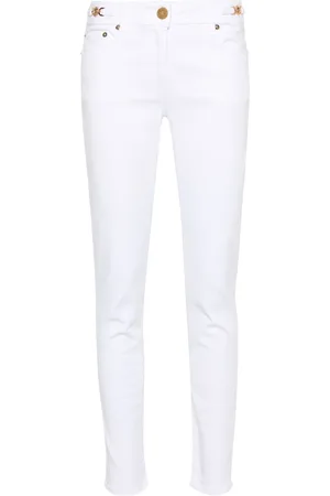 VERSACE Jean skinny à plaque Medusa