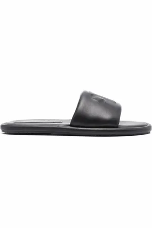 Nanushka Sandales en cuir à logo embossé
