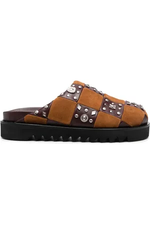 TOGA VIRILIS Mules en cuir à détails de clous
