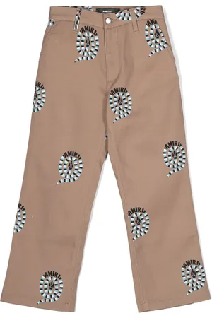 AMIRI Pantalon chino à imprimé peau de serpent