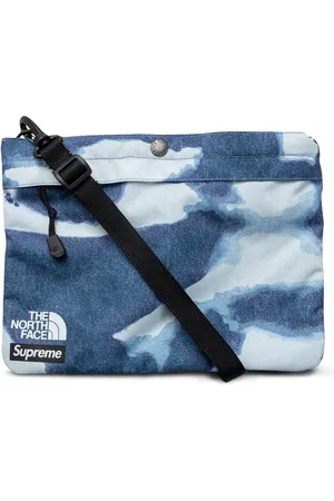 Supreme X TNF sac porté épaule en jean à effet délavé