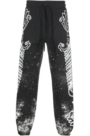 VERSACE Pantalon de jogging à imprimé graphique
