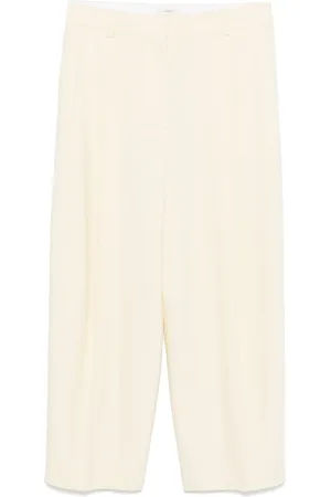 Totême Pantalon à design plissé