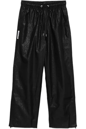 A Bathing Ape Pantalon à monogramme imprimé