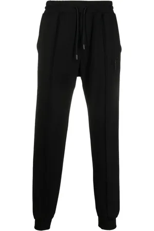 Giuseppe Zanotti Pantalon de jogging à logo strassé