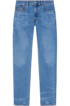 VERSACE Jean slim à ornement Medusa Head