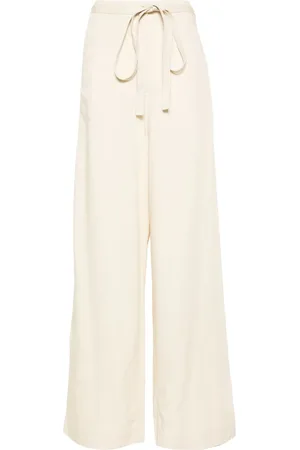 Totême Pantalon évasé à taille ceinturée