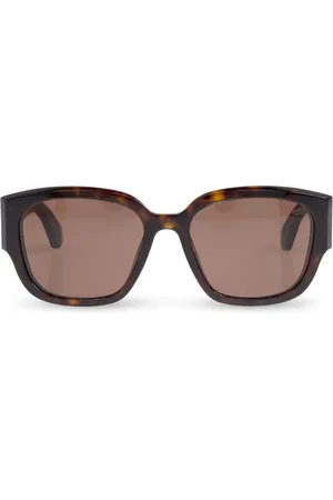 Alexander McQueen Lunettes de soleil à logo gravé