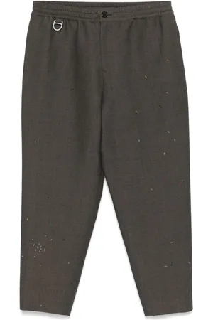 UNDERCOVER Pantalon à motif brodé