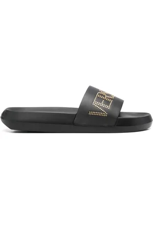 VERSACE Claquettes en cuir à logo clouté