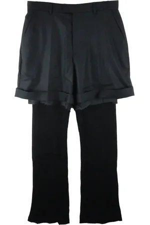 UNDERCOVER Pantalon à design superposé