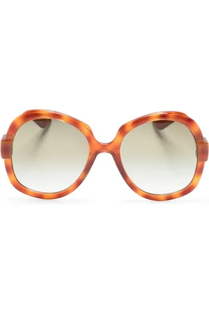 Gucci Lunettes de soleil oversize à logo gravé