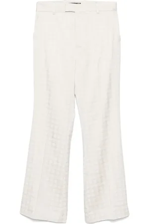 AMIRI Pantalon évasé à motif monogrammé