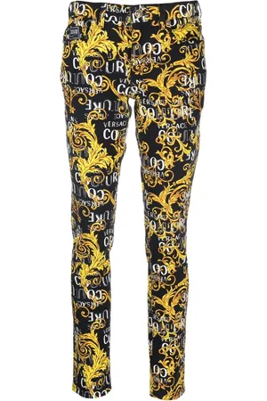 VERSACE Jean skinny à logo imprimé