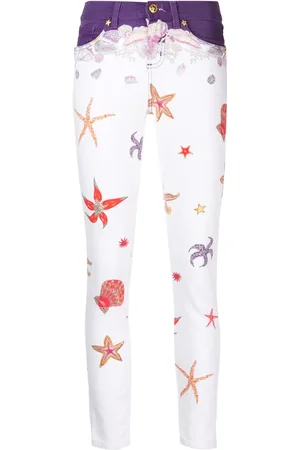 VERSACE Jean skinny imprimé à taille basse