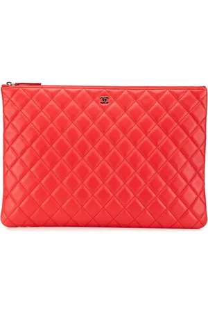 CHANEL Grande pochette O Case en peau d