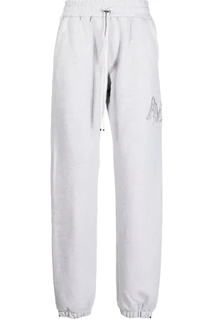 AMIRI Pantalon de jogging Staggered à logo brodé