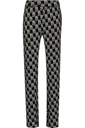 We11 Done Pantalon texturé à motif monogrammé