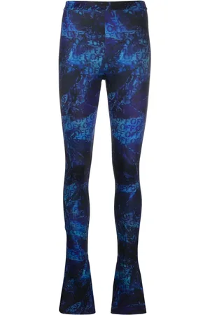 OFF-WHITE Pantalon évasé à logo imprimé en all over