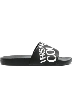 VERSACE Claquettes à logo en embossé