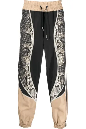 Roberto Cavalli Pantalon de jogging à imprimé serpent
