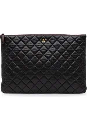 CHANEL Grande pochette matelassée O Case en cuir Caviar matelassé (2013-2014)