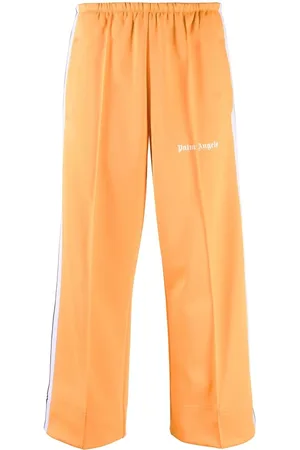 Palm Angels Pantalon de jogging crop à rayures latérales