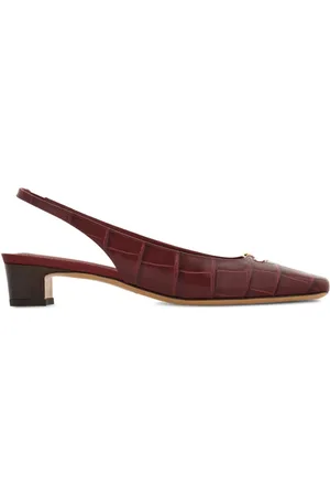 Salvatore Ferragamo Delightfully unassuming, this demure slingback features an elegant squared tip with a small rectangular cut out that is placed in front o...
