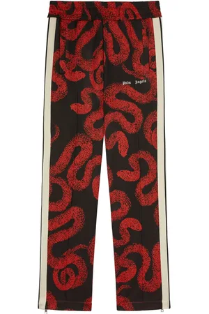 Palm Angels Pantalon de jogging à imprimé serpent