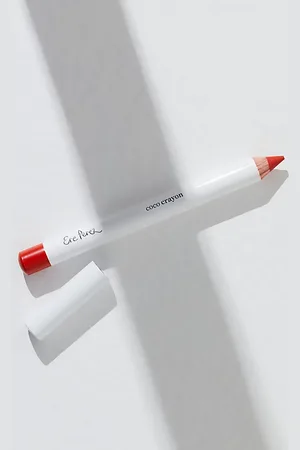Ere Perez Crayon à lèvres à la noix de coco par en Spark (Rouge Orange Vif), pour femme chez Free People